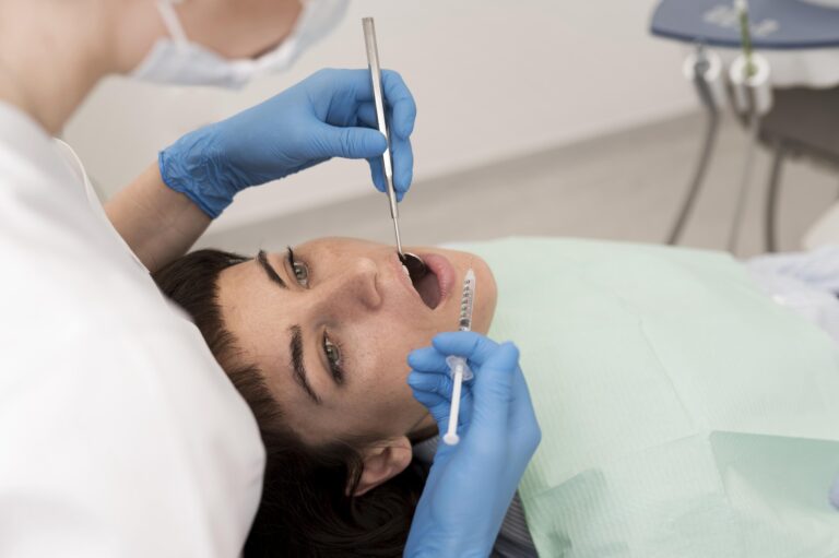 female patient having procedure done dentist