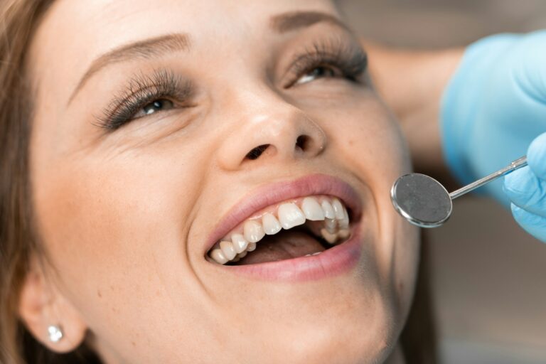 The dentist carefully works on the patient's smile, creating the perfect balance between aesthetics